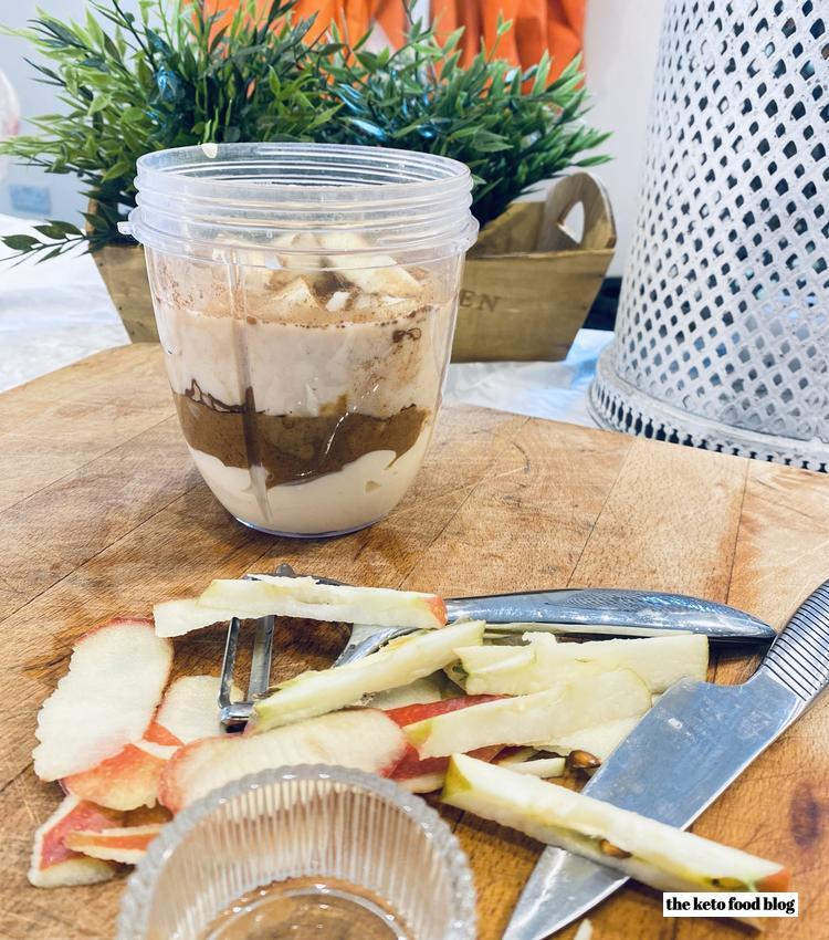 Chopped and cored apple and layered cup of ingredients