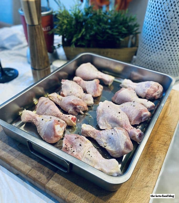 Chicken drumsticks marinated in oven tray