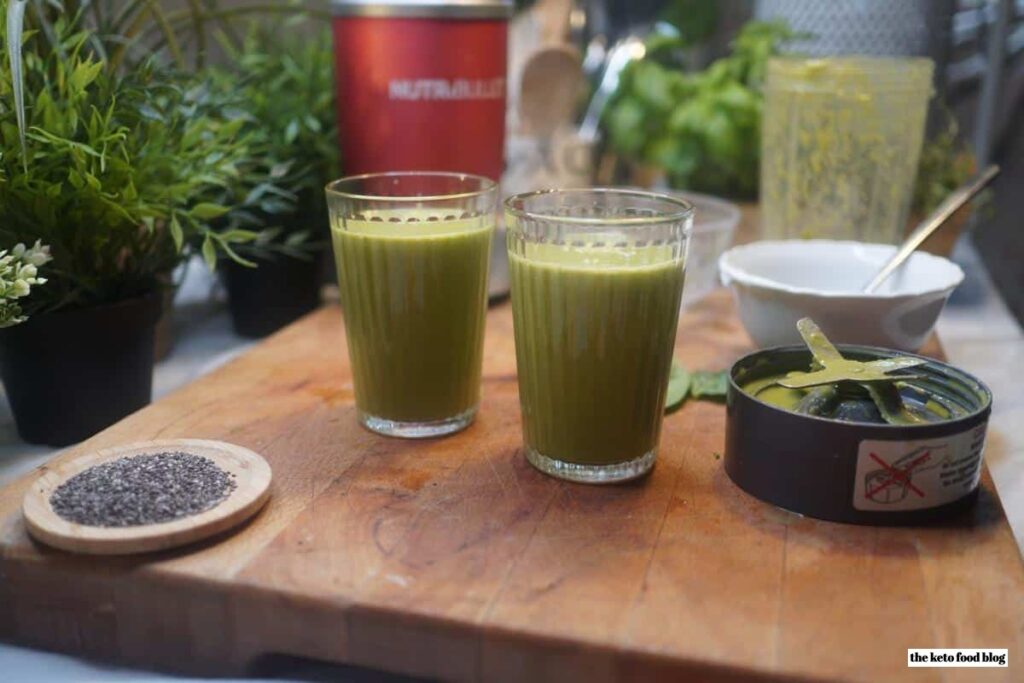 Winter Fruit Green Smoothie on wooden chopping board