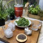 Ingredients for Mean Green Smoothie on wooden chopping board