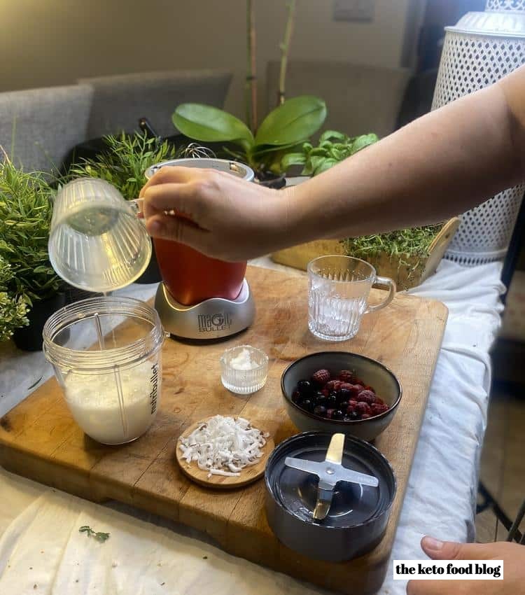 Pouring coconut milk into a nutribullet blending cup
