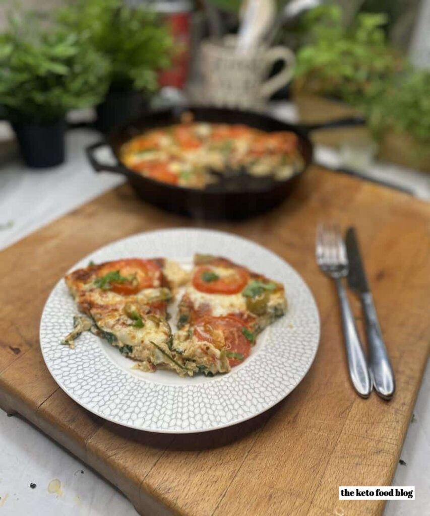 Pizza on wooden chopping board. Frittata