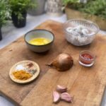 Ingredients for Spicy Sriracha Shrimp on wooden chopping board