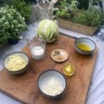 Ingredients for Low-Carb Mac n Cheese on a wooden chopping board