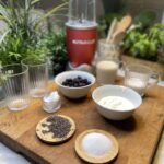 Ingredients for a smoothie on a wooden chopping board