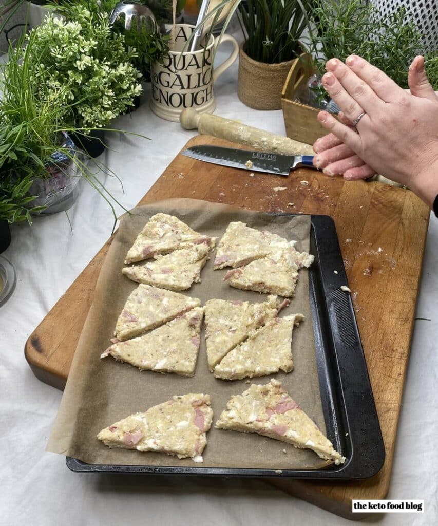 Triangular keto scone dough on a baking sheet
