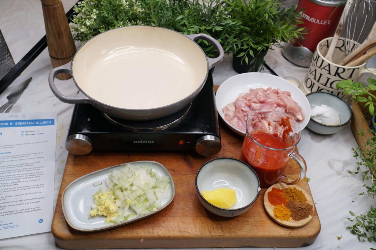 chopping board with ingredients for cooking the keto chicken korma recipe